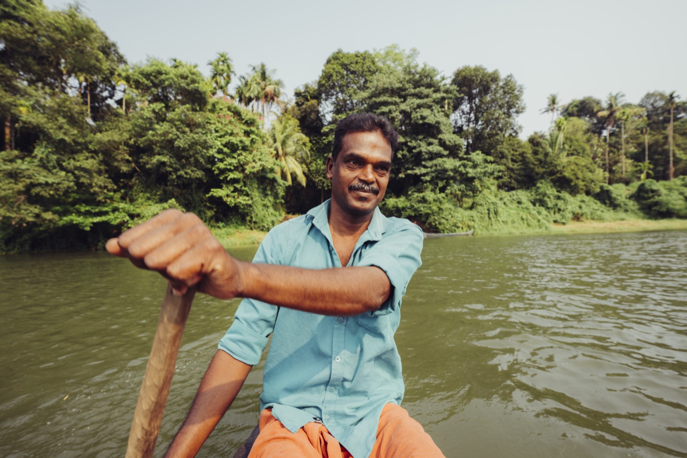 Our boatman mid-river