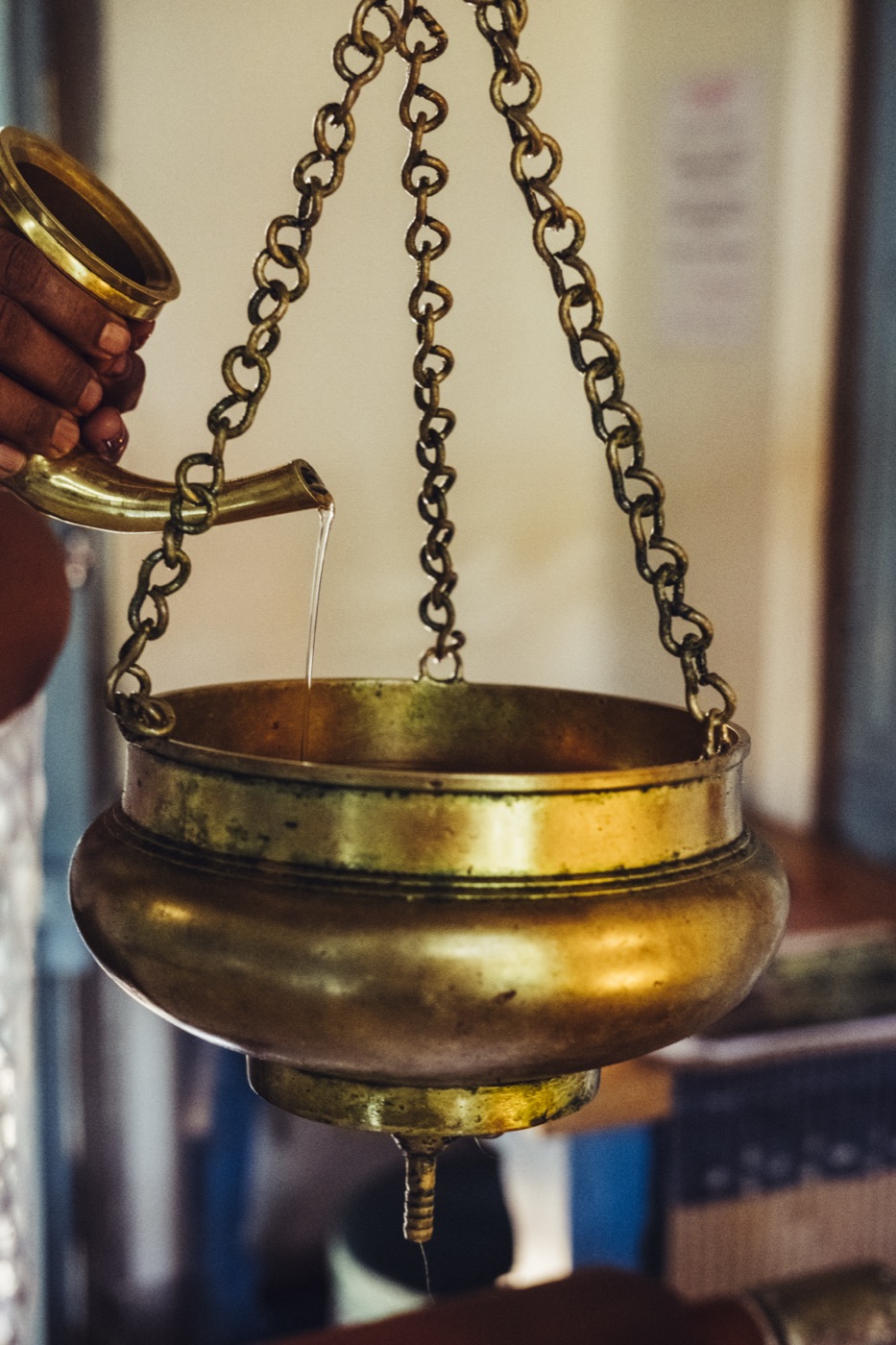 A brass shirodhara vessel
