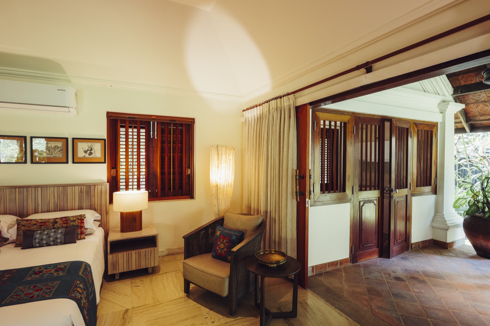 The Hanuman room with sliding doors open to the veranda