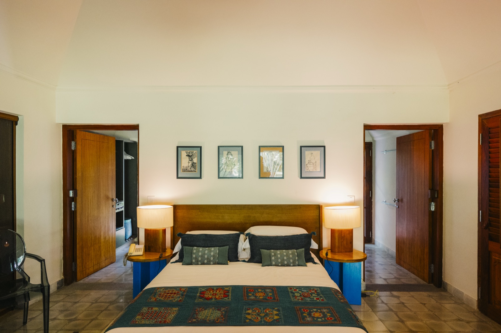 The Krishna room, a king bed between shuttered doorways